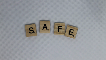Scrabble tiles spelling out the word 'safe'